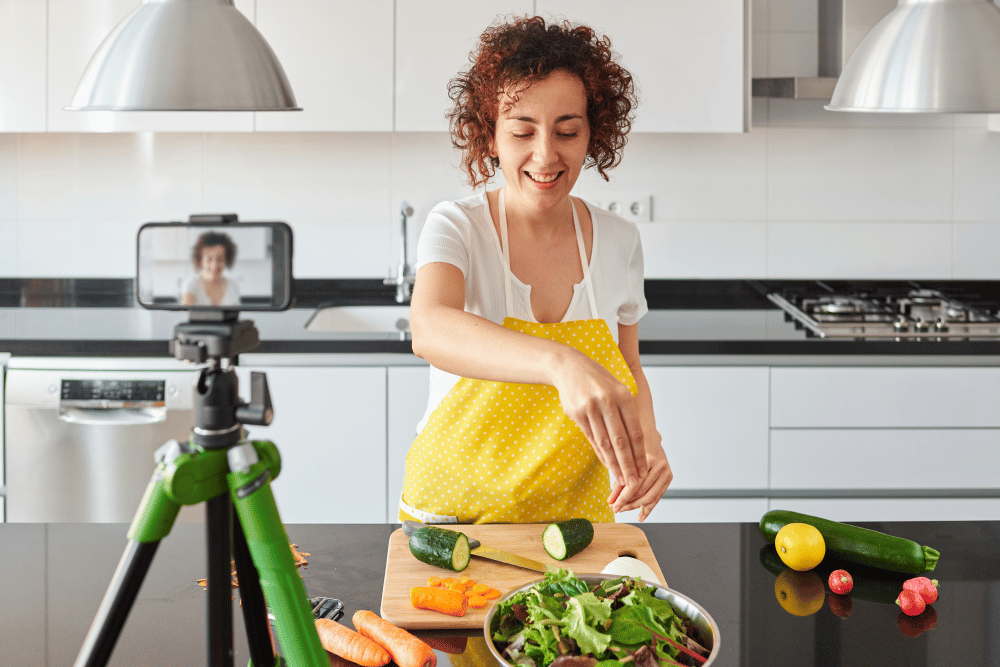 Influencer making some food in front of a camera